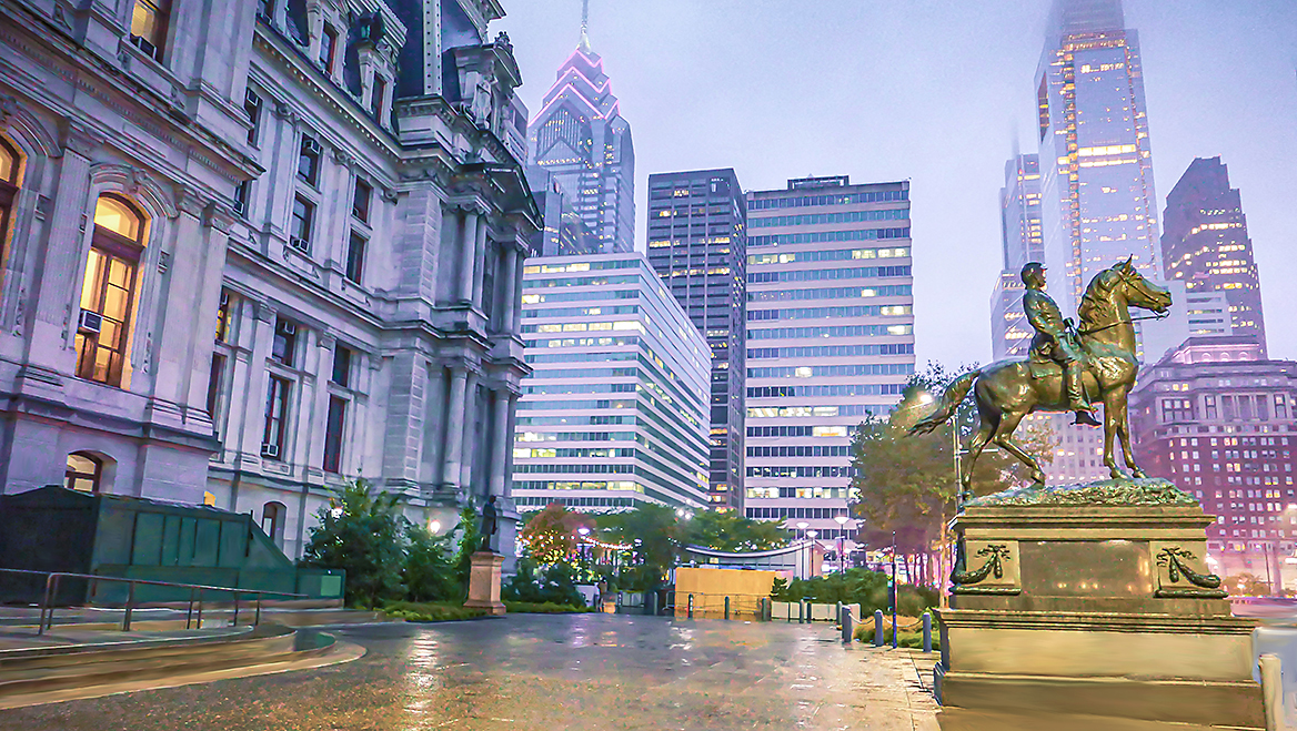 Philadelphia at night, with the Penn Center buildings in the distance. Photo by Olga Kaya/iStock/Getty Images Plus.