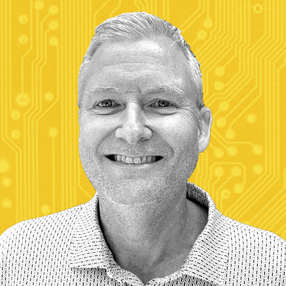 Bret Keast Portrait of a smiling man, Bret Keast, with a circuit board background
