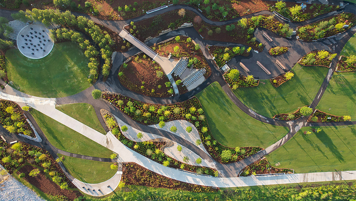 Sculpted topography frames the riverfront, while 32 functional basalt sculptures and a towering sculpture of hero Tom Lee (not shown) comprise artist Theaster Gates's Monument to Listening. Photo by SCAPE/John Donnelly.