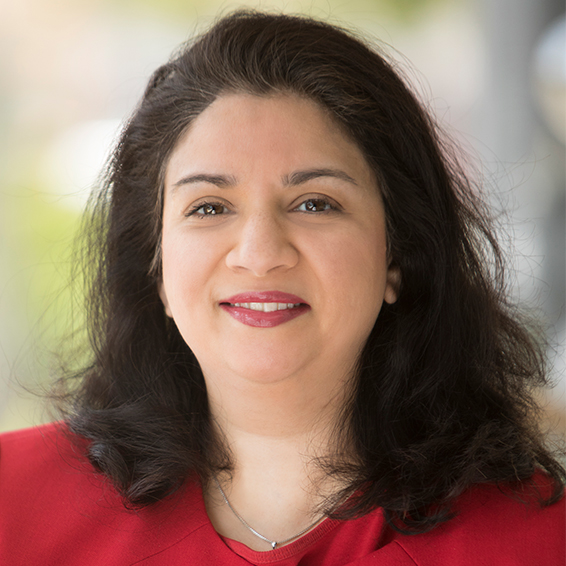 Planning August 2026 What Jobs Will Actually Stabilize Over the Next 10 Years image 02 Portrait of a woman, Ameera Sayeed, with dark hair and a red top.