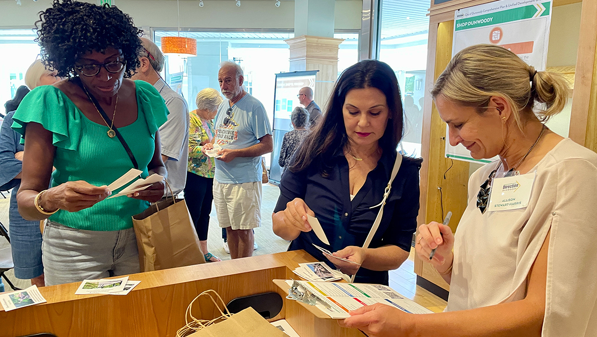Participants at Shop Dunwoody chose up to 10 items they envisioned for the community's future before checking out with Allison Stewart-Harris or other members of the planning team. Photo courtesy of TSW.