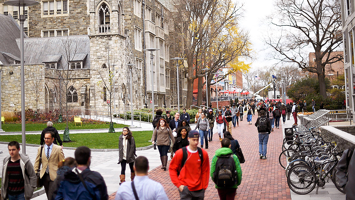 Bacon’s work in Flint, Michigan, gave him insight to a successful mediation between Temple University and its neighbors. Here, students walk through the campus of Temple University in Philadelphia. Photo by REUTERS/Mark Makela/Alamy.