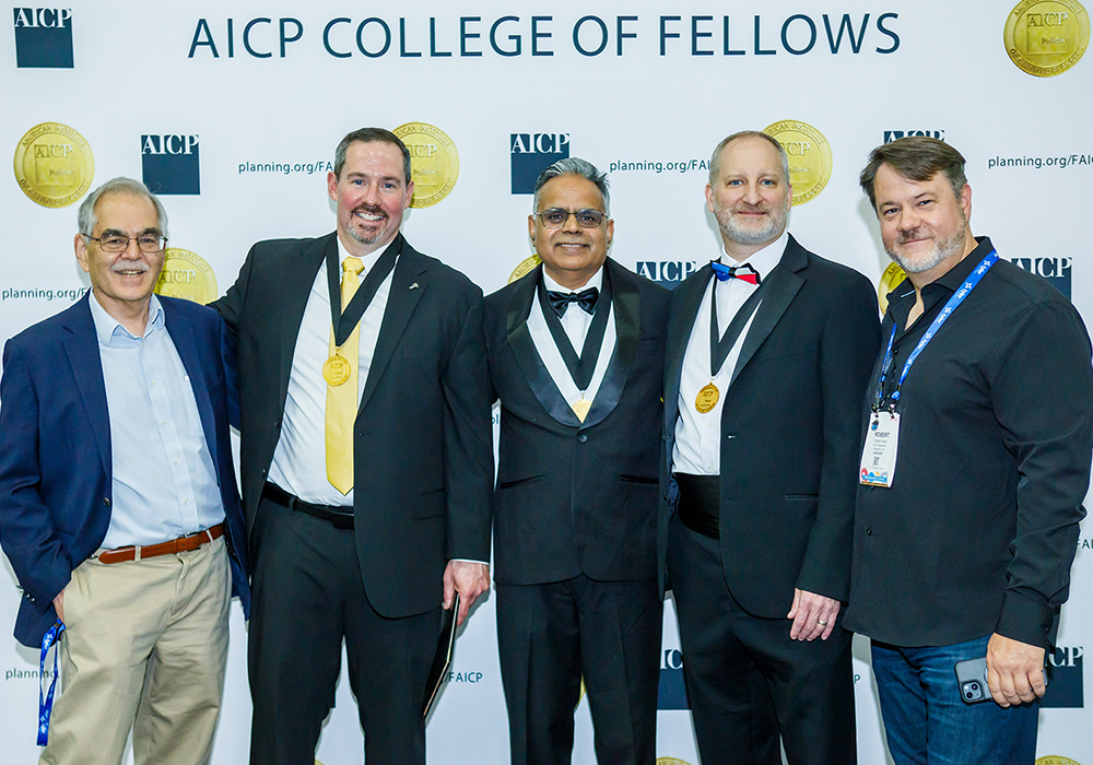 Scott Turner, FAICP (second from left), poses for a photo after being inducted into the Fellows of the American Institute of Certified Planners at NPC26 in Detroit.