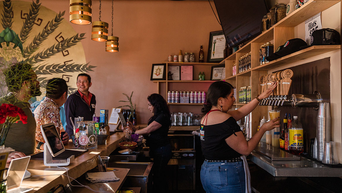 The bar at the Mujeres Brew House, a Latinx women-founded and -led community brewing space, educational facility, and taproom.