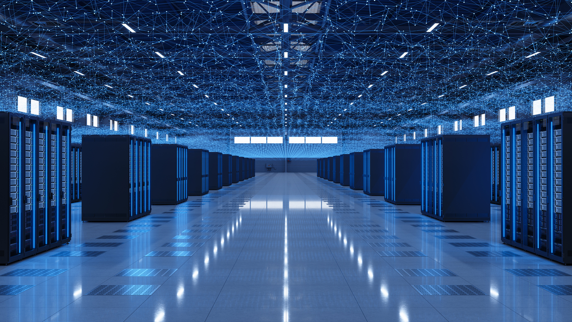 The interior of a data centers with servers lit up blue.