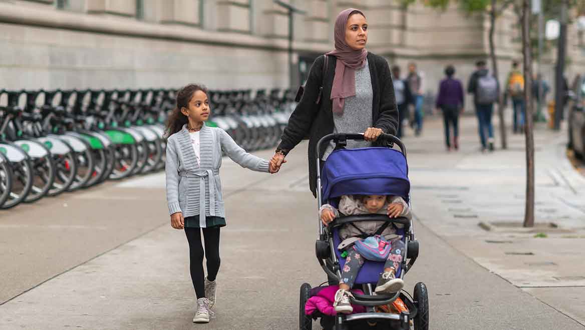 A healthy pedestrian realm allows for enough space to accommodate all ages, physical abilities, and activities. Navigating sidewalks with strollers can be difficult or even dangerous when there isn't enough space. Photo by FatCamera/E+/Getty Images.
