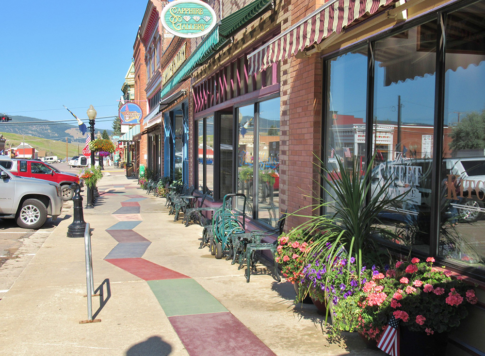 This image features multiple storefronts along a commercial corridor in Philipsburg, Montana.