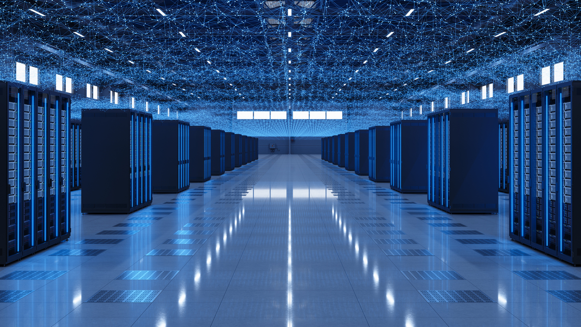 The interior of a data centers with servers lit up blue.