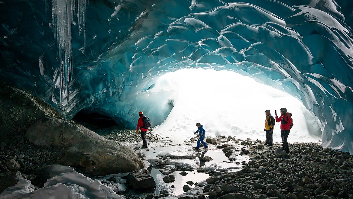 As weather patterns change and threaten traditional tourist hotspots, travelers are flocking to colder destinations for wintry activities. Photo by AscentXmedia/E+.