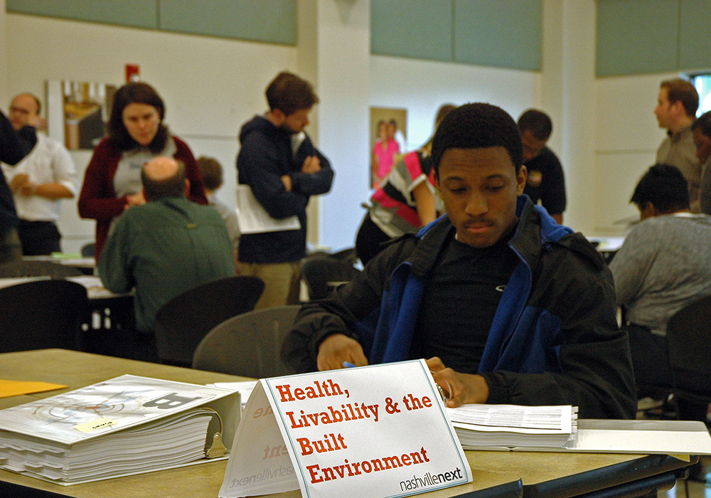 Quiet reading and active conversations at a Plan Review open house