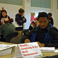 Quiet reading and active conversations at a Plan Review open house.