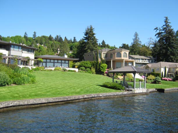 Wishing to replace the aging concrete bulkhead that extended the length of the shoreline and remodel the guest house