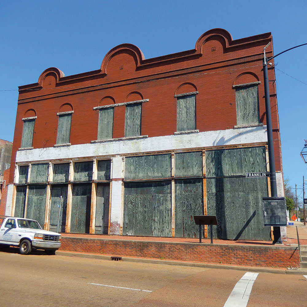 An abandoned downtown building with historic facade