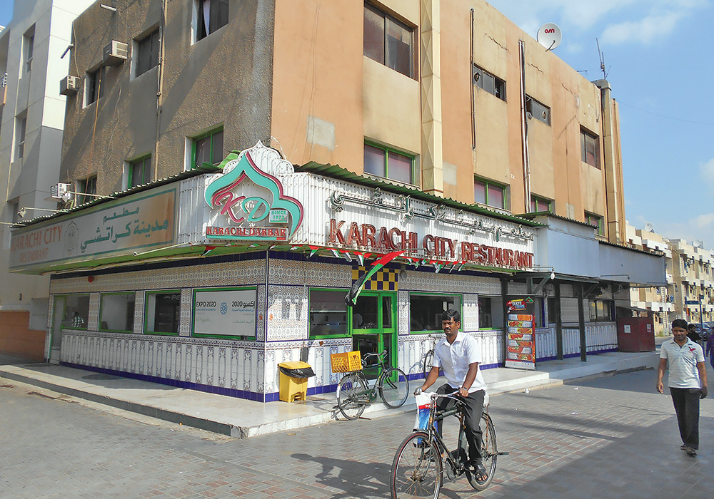 The Master Plan of Dubai, completed in 1960, extended the old city into large, repetitive grids of concrete blocks with interior streets. These blocks offer relatively affordable apartments in a walkable neighborhood. Photos by Alan Mammoser.