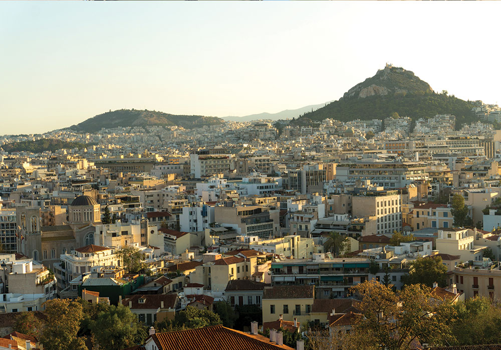 Morning view looking north from the foothills of the Acropolis. Beyond the densely clustered blocks of central Athens is Mount Lycabettus. Photo by Michael Kavalar.