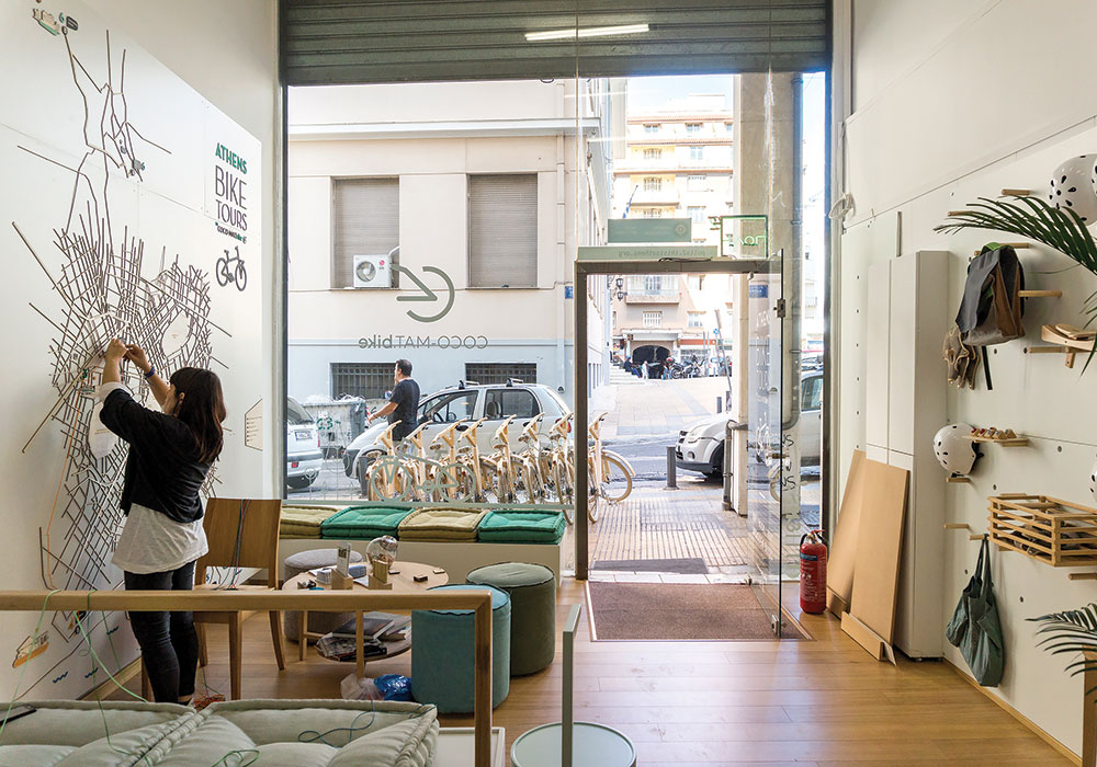 The day before the official launch of Polis2, staff members of Coco Mat — a sustainable bicycle rental store aimed at tourists — finishes setting up shop. Photo by Michael Kavalar.