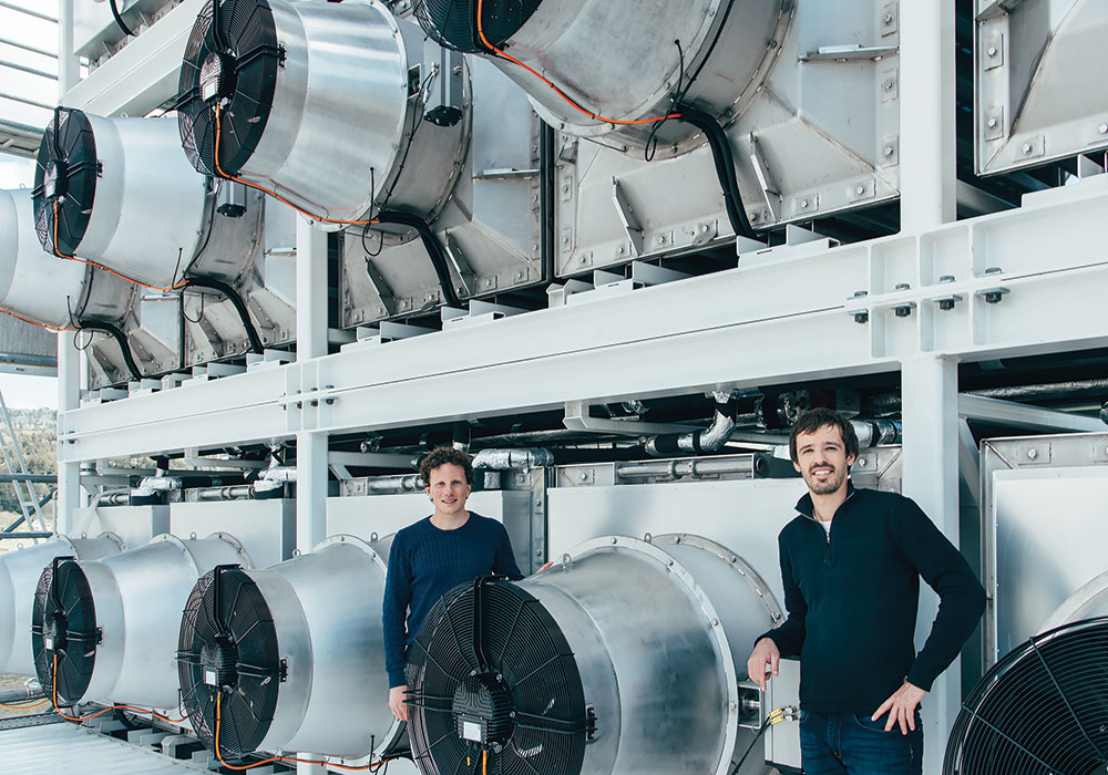 Climeworks founders Christoph Gebald and Jan Wurzbacher at their direct air capture plant in Hinwil, Switzerland. Watch a video to learn more about how the technology can mitigate carbon dioxide production. Photo by Julia Dunlop/©Climeworks.