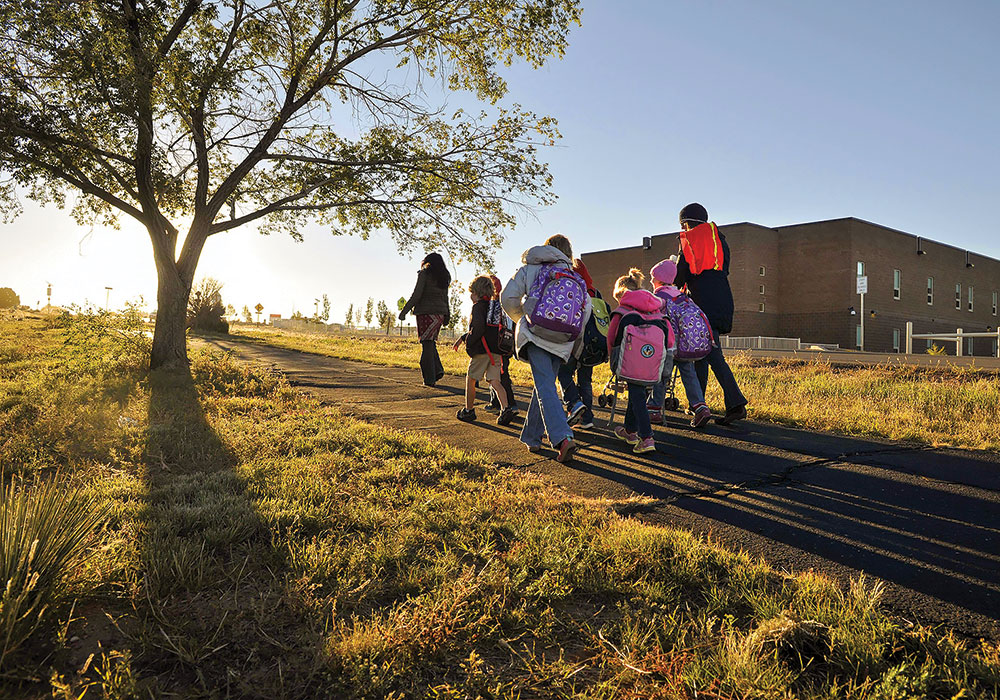 Safe Routes to School programs find ways to get kids on their feet &mdash; especially when schools are built on the outskirts of town. Photo by Eddie Moore/Albuquerque Journal/Zumapress.com.