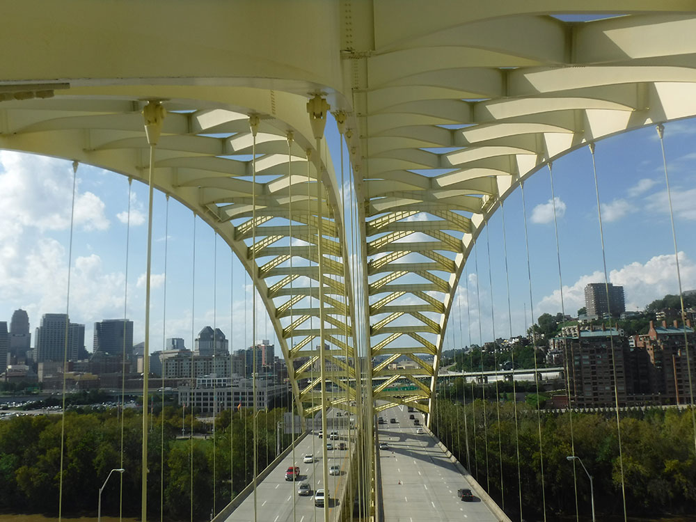 Drones can help with asset management. In 2018, Michael Baker worked on a UAS-assisted inspection of the Daniel Carter Beard Bridge that connects Cincinnati with Newport, Kentucky. Using a combination of UAS and rope access inspectors, the team produced a complete assessment of the cables for the Kentucky Transportation Cabinet. Photo courtesy Michael Baker International.