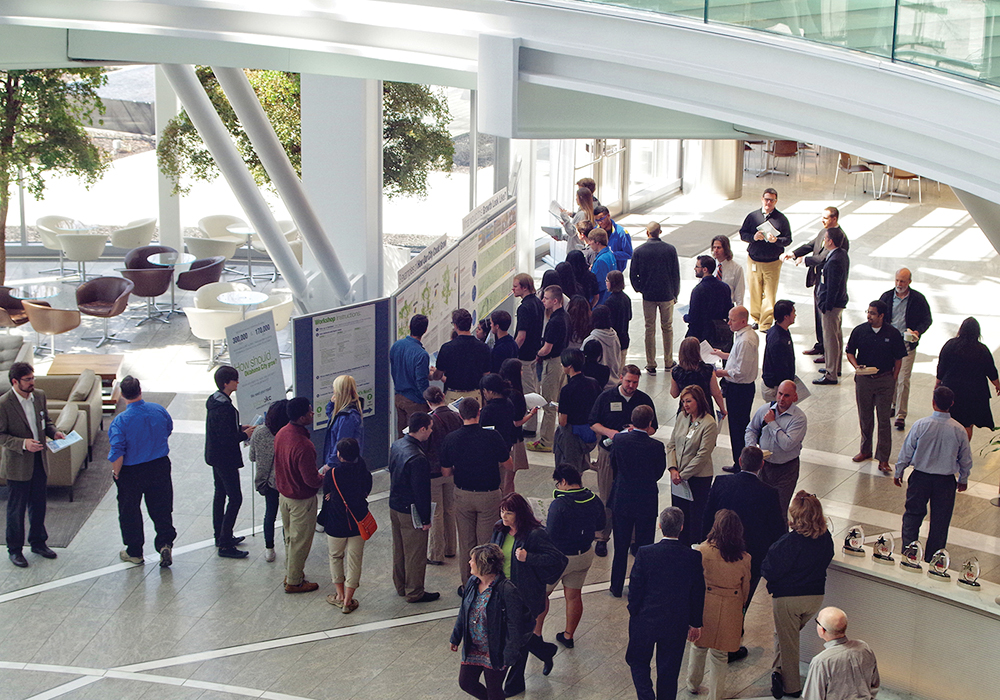 Visitors stop by the planokc exhibit to provide