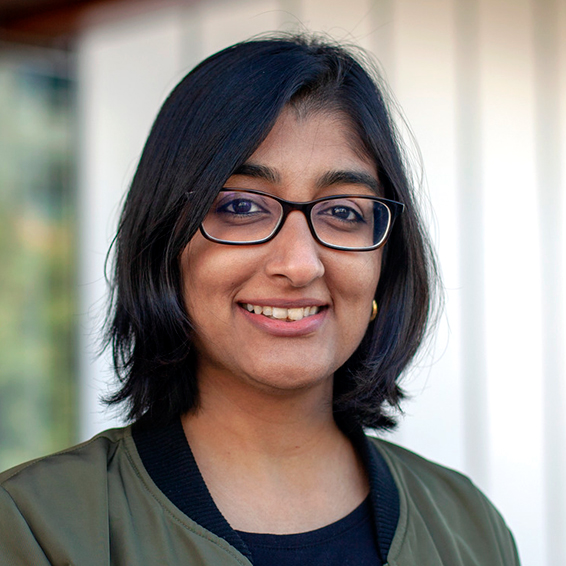 Planning October 2026 Cities Can Be Messy image 02 Portrait of a smiling woman, Shruti Shankar, AICP, with short dark hair and glasses.