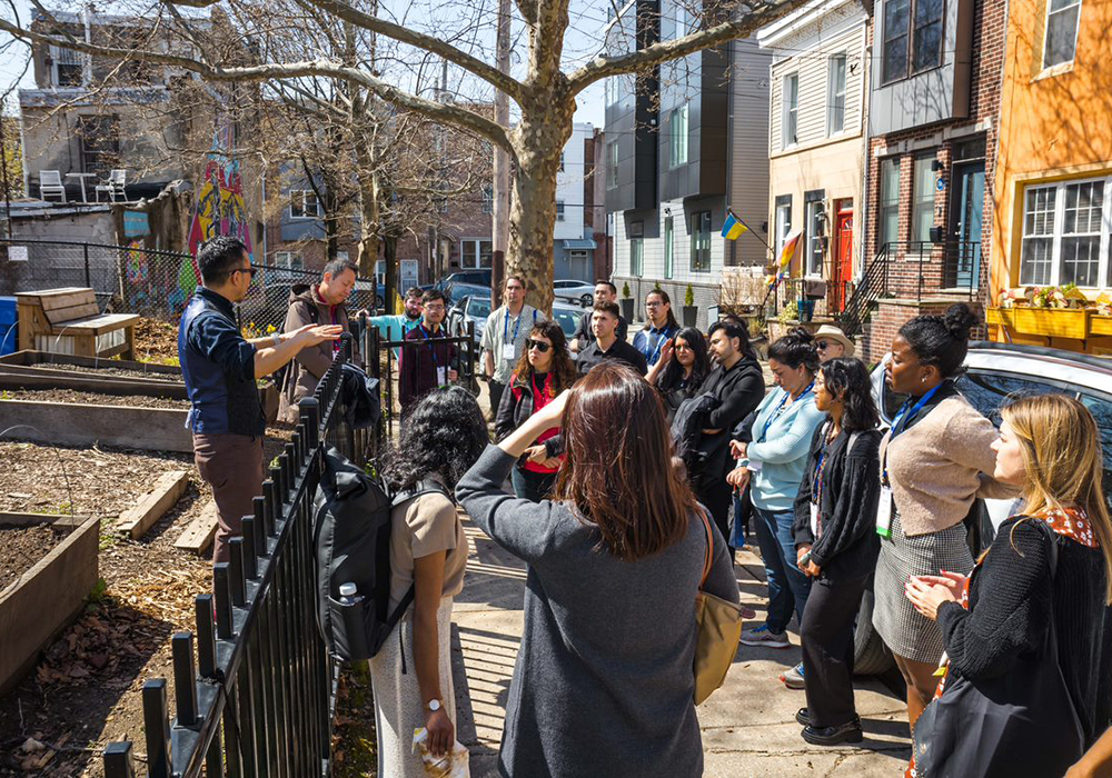 SEAMAAC CEO Thoai Nguyen provided API members context on the Growing Home Community Garden, which provides garden plots to immigrant and refugee residents. Photo credit: Tobin Stuff