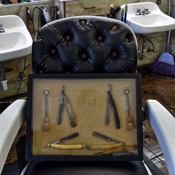 A community gathering place, the shop has momentos from its barbering history and the broader civil rights era. Photo courtesy of Urban Impact Birmingham.