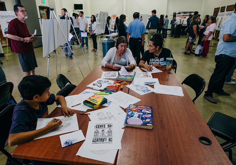 Two community stakeholders complete a survey during a Boyle Heights Community Plan Update open house. Image: Los Angeles City Planning