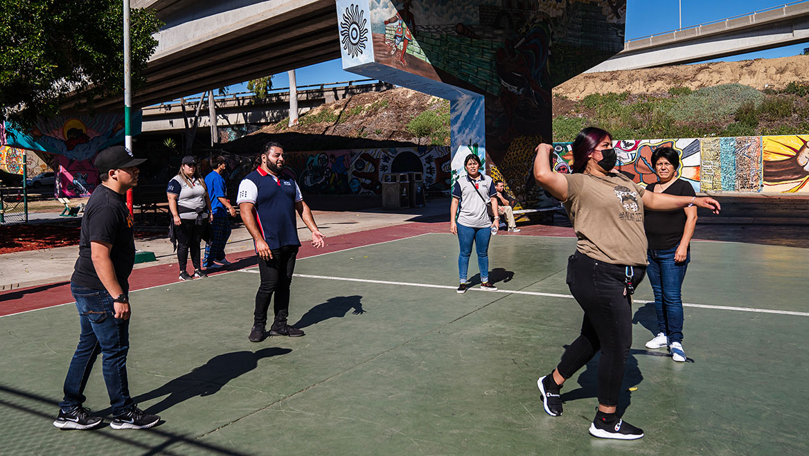 Volunteers from the Youth Power Group play handball in Chicano Park.