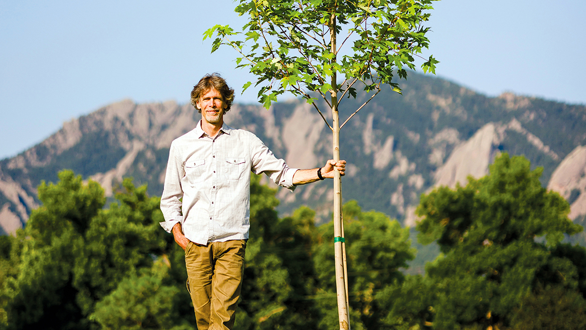 Young people from the Community Forestry Corps help plant and water trees on a school site (below) in Boulder, Colorado, in August 2025. To supply the water, Boulder planner and Senior Climate Policy Advisor Brett KenCairn (above) found an innovative temporary watering technique that relies on fire hydrants. Photos by Michael Ciaglo.
