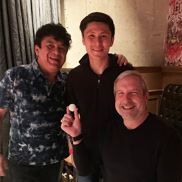 Carlos Parra with colleagues at a staff event.