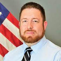 A headshot of Benjamin Almquist.