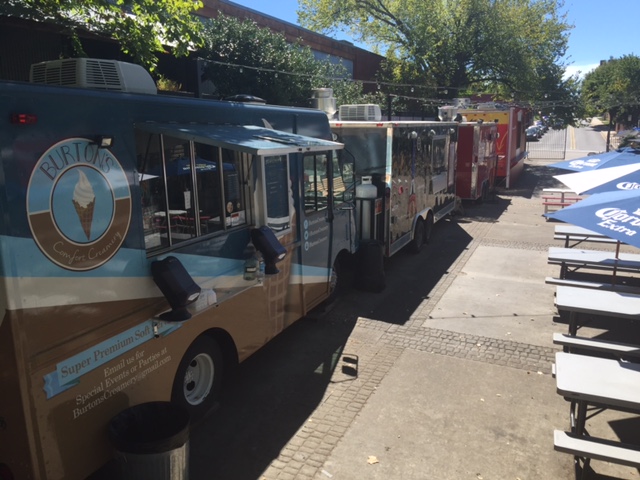 Food trucks line up in an open-air bazaar. (Photo credit: John Gaber, AICP)