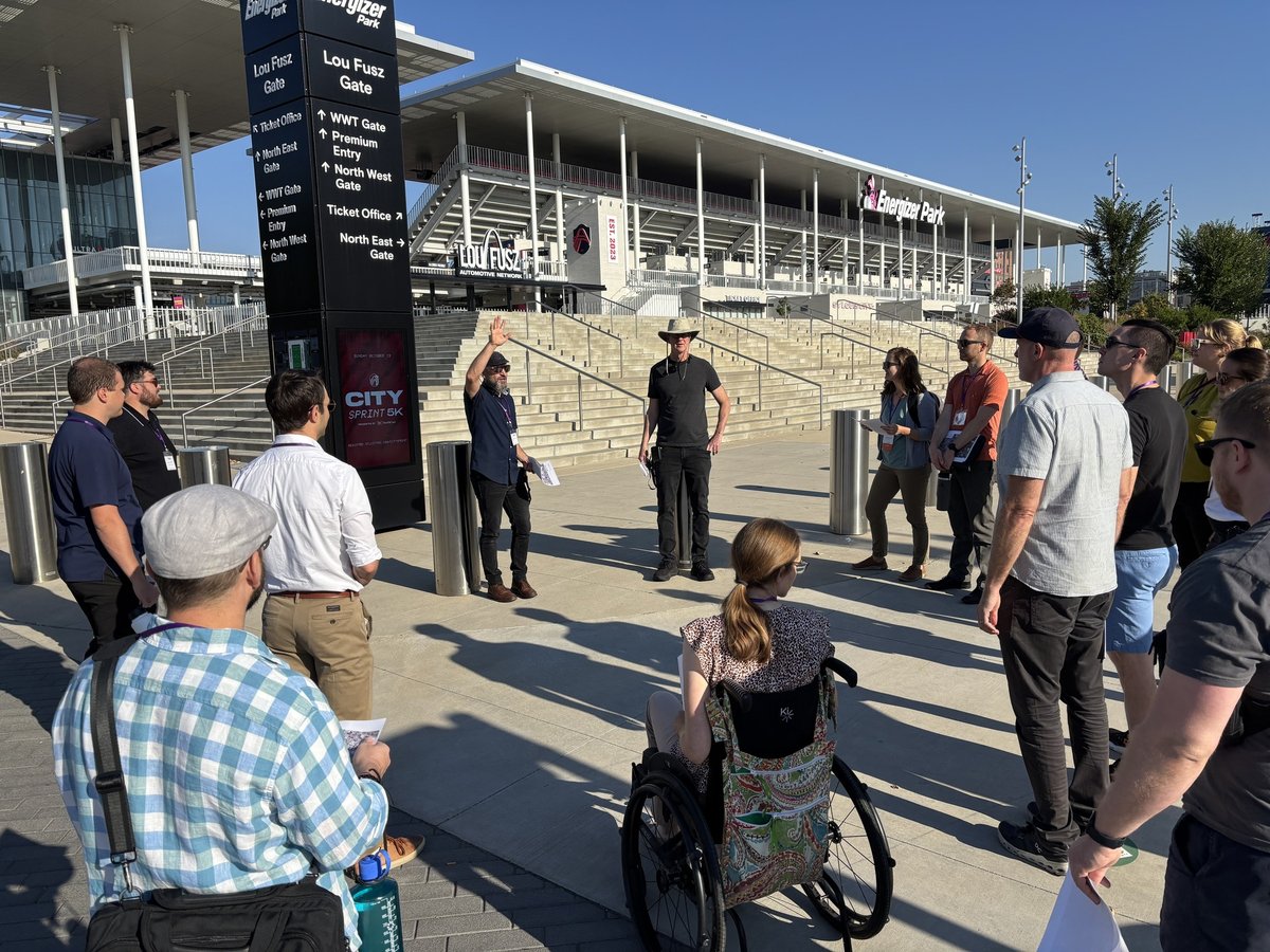 Jeff Speck leads a group of conference attendees on a mobile tour