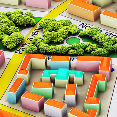 Molded plastic blocks representing the built form of individual buildings placed on a flat map of a hypothetical city.