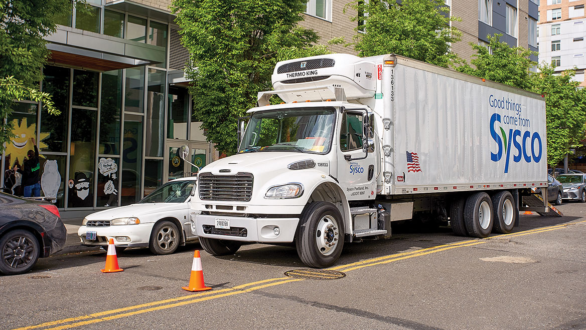 Bikes, deliveries, pedestrians, ride-hailing, and private vehicles all vie for limited curb space. A framework can help balance these uses and needs. Photo by Tada Images/Shutterstock.