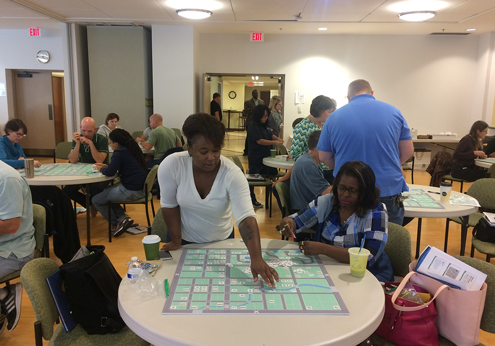 The student becomes the planner: PPA participants arrange a mix of land uses on a game board.