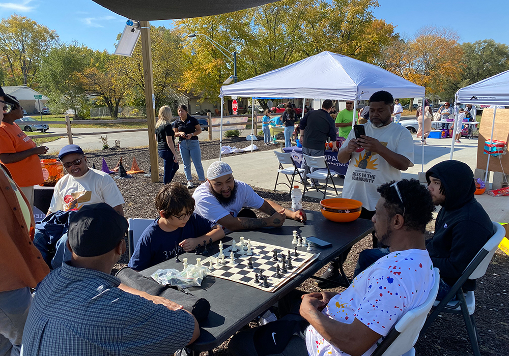 Community members learning and playing chess in Hedge POP! Park. Photo courtesy of City of Champaign, Illinois.