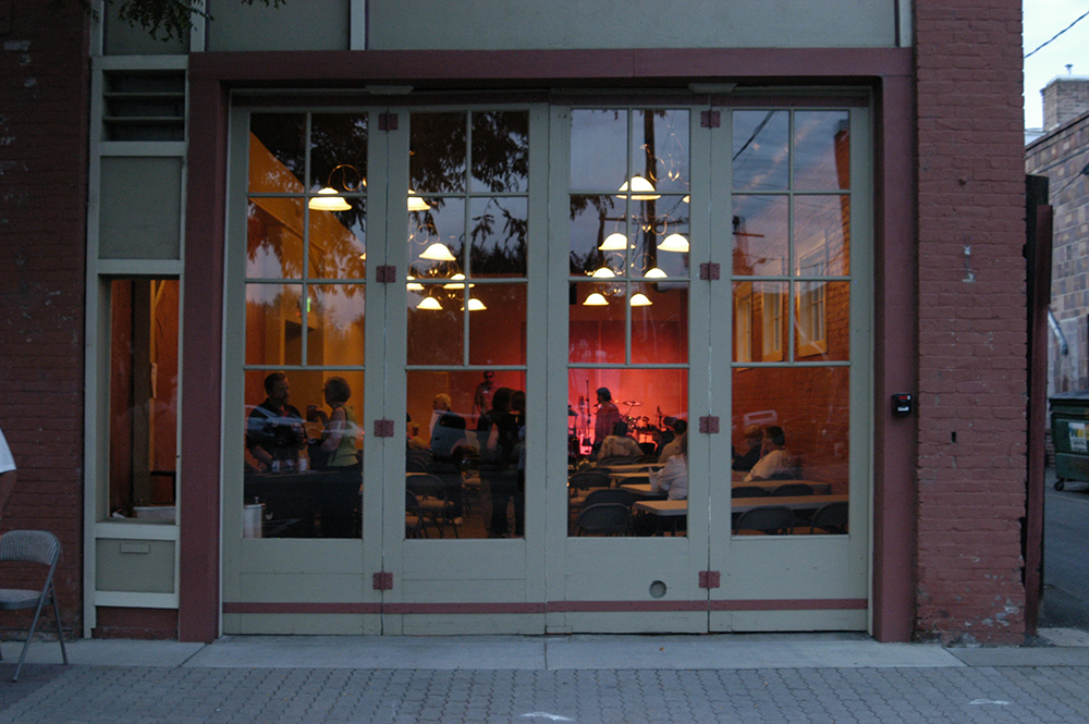 This image shows a facade of a building that has been adapted from an auto repair shop to a special events venue in Downtown Ellensburg.