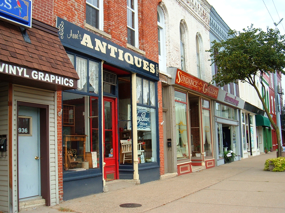 This image shows a colorful array of street-level stores with second stories.