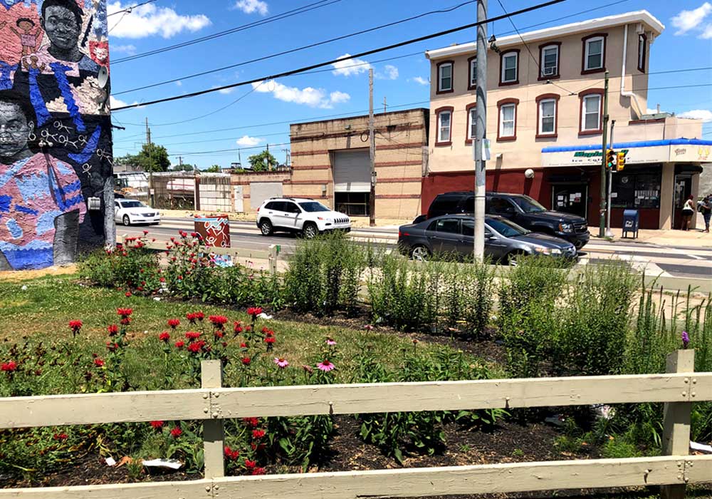 Before and after restoration photos of a vacant lot in the Mantua neighborhood of Philadelphia.