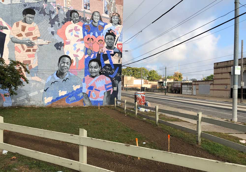 Before and after restoration photos of a vacant lot in the Mantua neighborhood of Philadelphia.