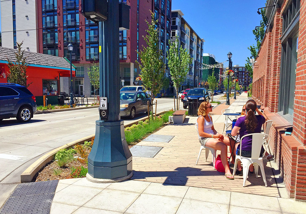 Residents enjoy a sidewalk cafe on Cleveland Street. Photo courtesy City of Redmond.