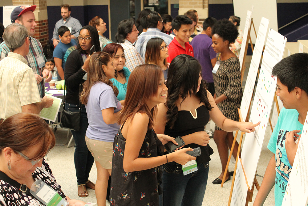 Community members review details of the new community plan