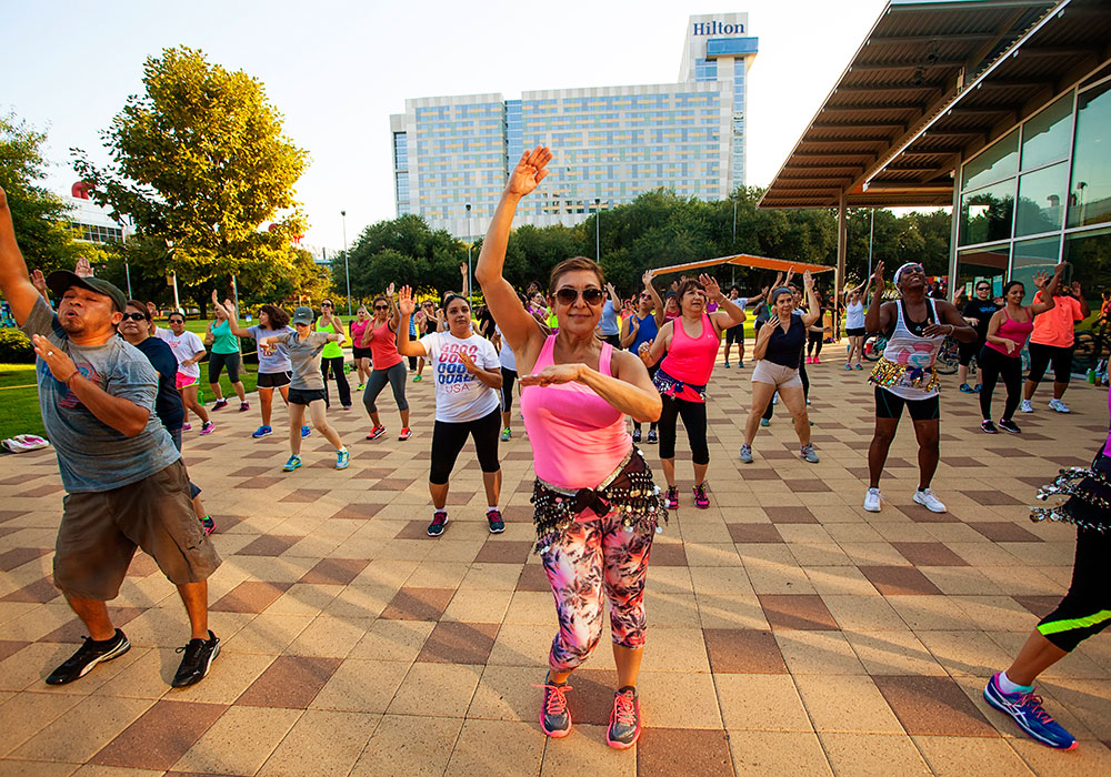 Residents enjoy an outdoor fitness class. Photo by Katya Horner.