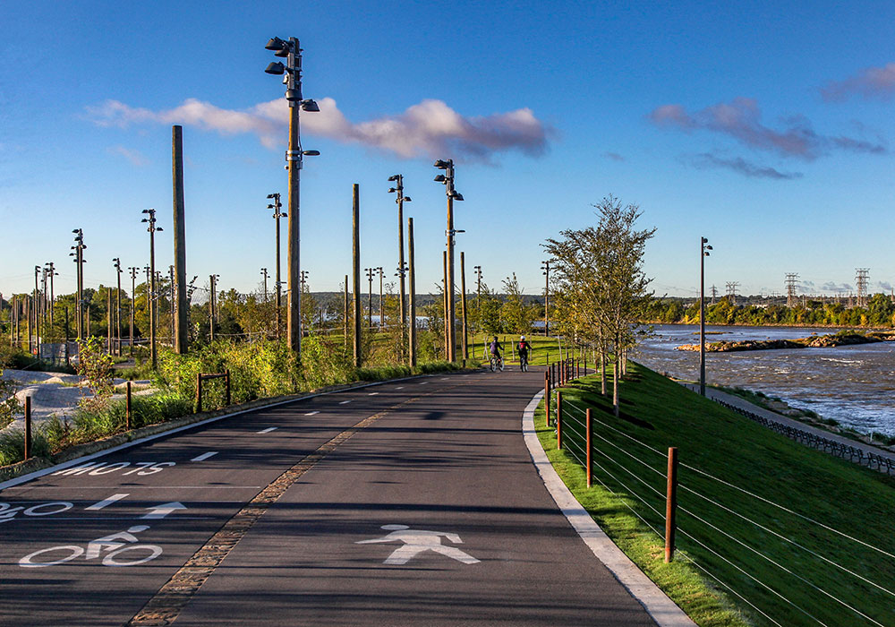 Cyclists enjoy a multi-use path in the park. Photo courtesy A Gathering Place for Tulsa.