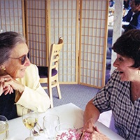 McCoy with lunch companion Professor McCoy enjoys lunch with a colleague. Friends recall her easy grace and interest in the careers of those she mentored.