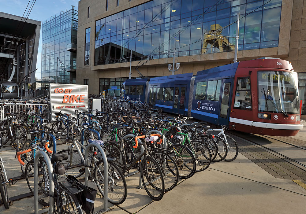 Here, the aerial tram, streetcar, bike parking, and Biketown bike share make car-free commuting easy and accessible at Portland’s South Waterfront. Photo by AP-C40.