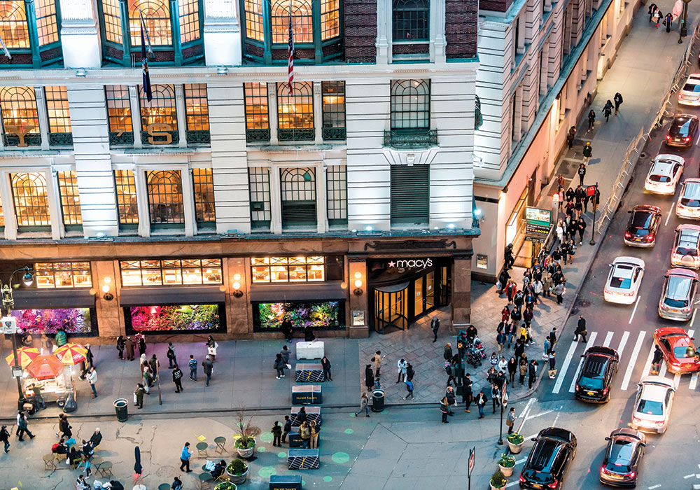 Every day, taxis, TNC vehicles, private cars, subway riders, and throngs of pedestrians jockey for curbside space outside Macy’s Herald Square in New York City. Photo by Andriy Blokhin/Alamy.