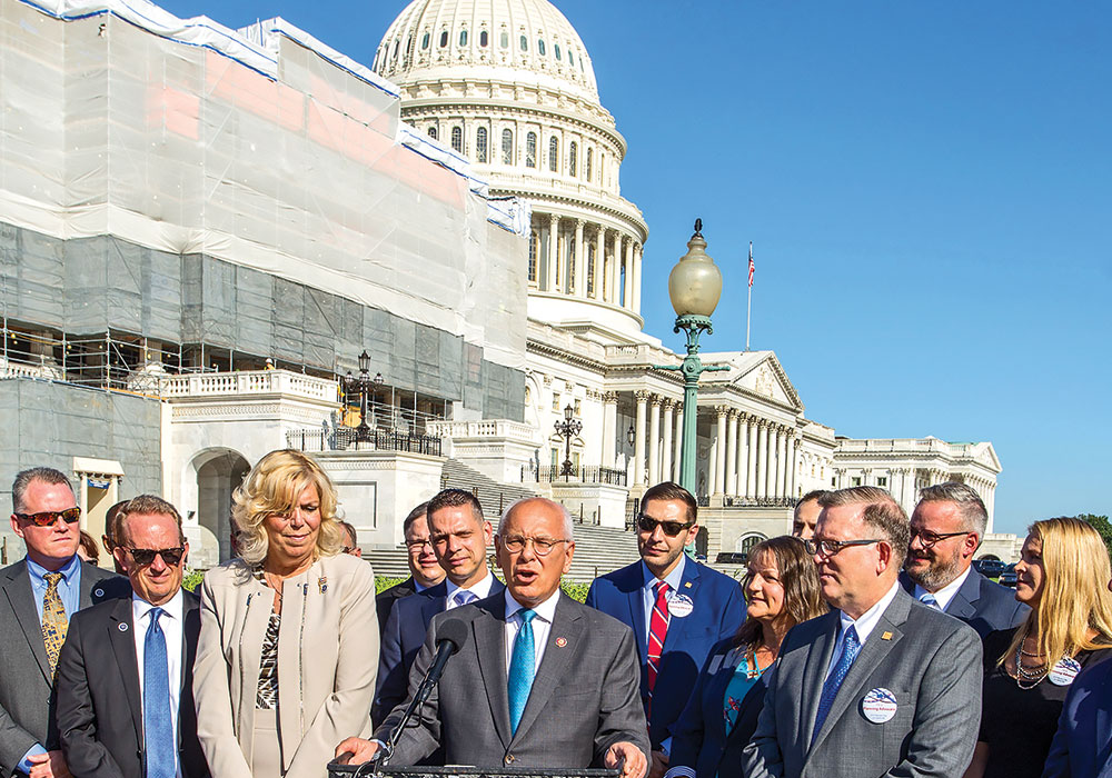 Representative Paul Tonko (D-N.Y., at podium) joined APA members, including President Kurt Christiansen, FAICP, (right) for the 2019 Great Places in America announcement on Capitol Hill. American Planning Association photo.